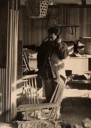 George Nakashima on the phone in his workshop