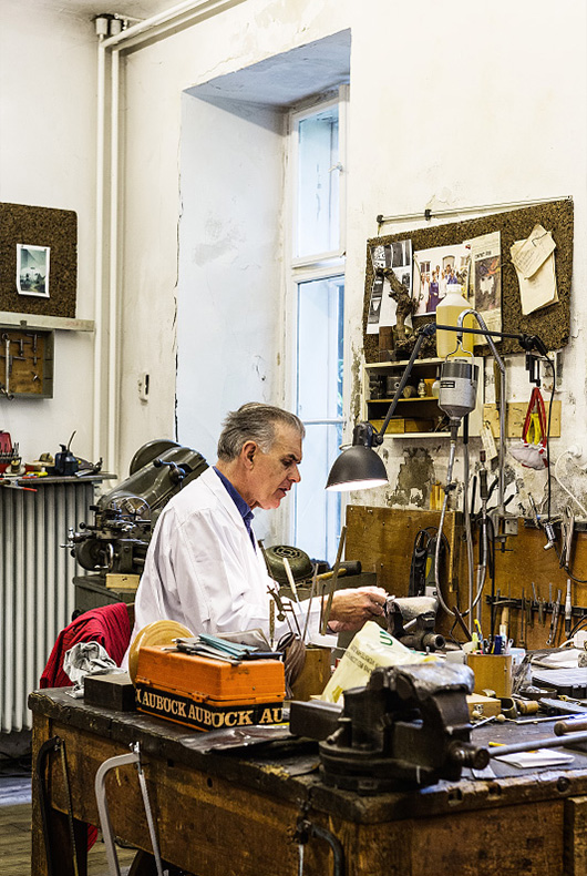 A man at work at his workshop in Vienna, Austria.