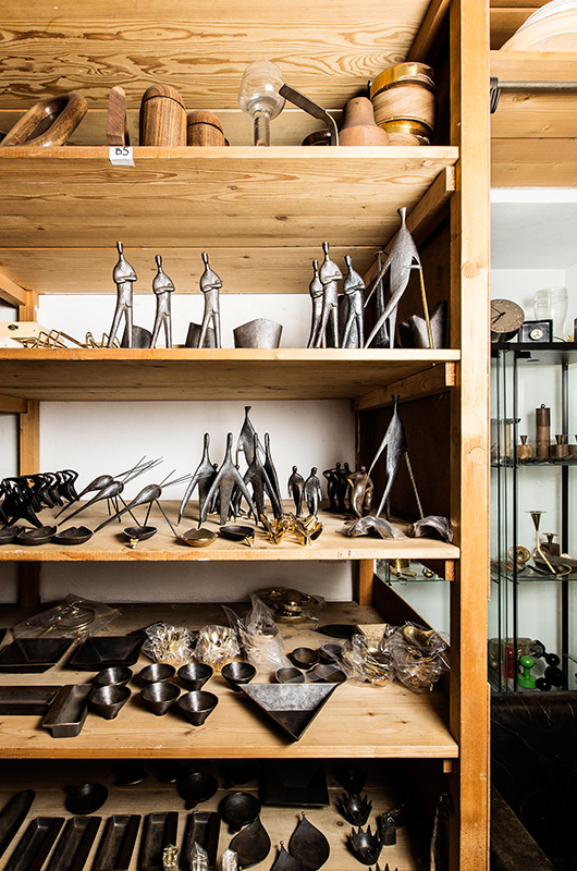 Shelving inside the Aubock showroom, beautiful metal, leather and stone objects.