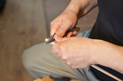 Eiji Hagiwara trimming the chopsticks by hand at his studio in Japan.