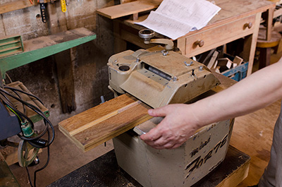 Eiji uses a special planing machine to cut the blanks for the chopsticks.