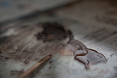 Making the lacquer which will be applied to the surface of a dish.