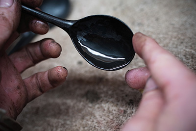 Excess lacquer on the black spoon by Hiroyuki Sugawara.