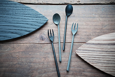 A selection of lacquer cutlery and tableware, like the small black spoon and shizuka plate.