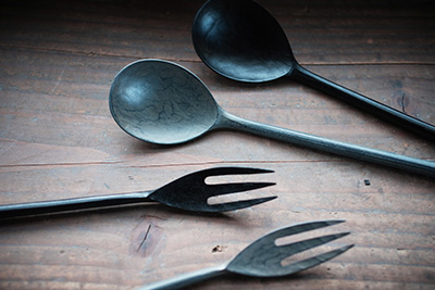 The popular black and white lacquer spoons, both can be found in the shop.