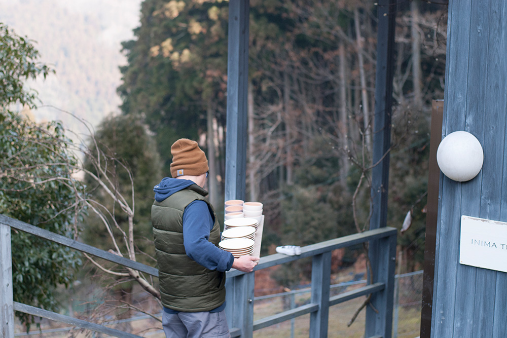 Yuichiro carrying the pots down to the kiln, this is where they will be fired.