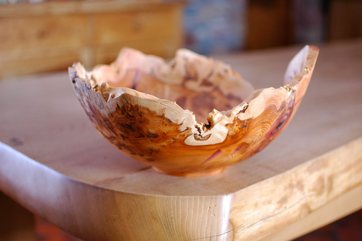 Turned from a piece of yew, this bowl with its dark orange heartwood and distinctive pale sap wood will compliment any table.