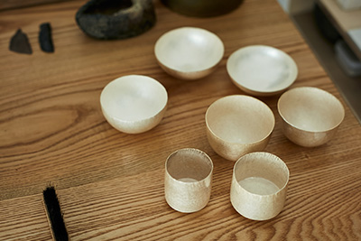 A selection of metalwork made by hand by craftsman Naho Kamada.
