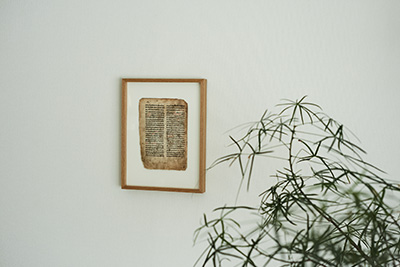 Picture frame hanging on her wall in her studio.