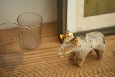 A ring and a small sculpture in the studio of metalworker Naho Kamada.