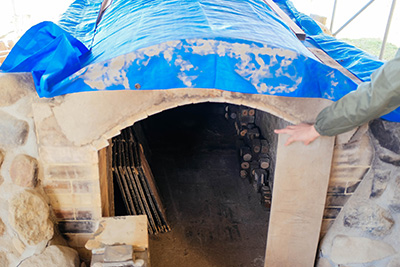 Keiji Tanaka opening his kiln that was built by him at his studio in Shiga Prefecture.