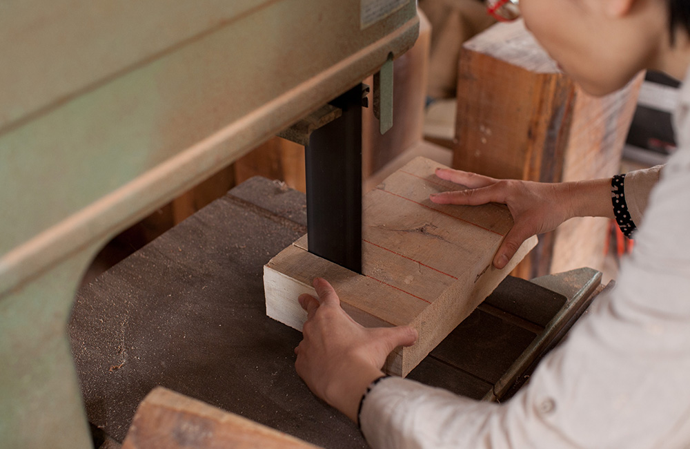 Cutting a selection of wooden blanks that will be used to craft her beautiful wooden objects.