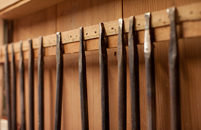 Maiko's custom chisels that are heated and crafted by hand, manipulating the tips for different purposes.