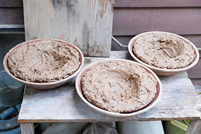 Leaving the clay to dry outside, this will later be kneaded and re-used.
