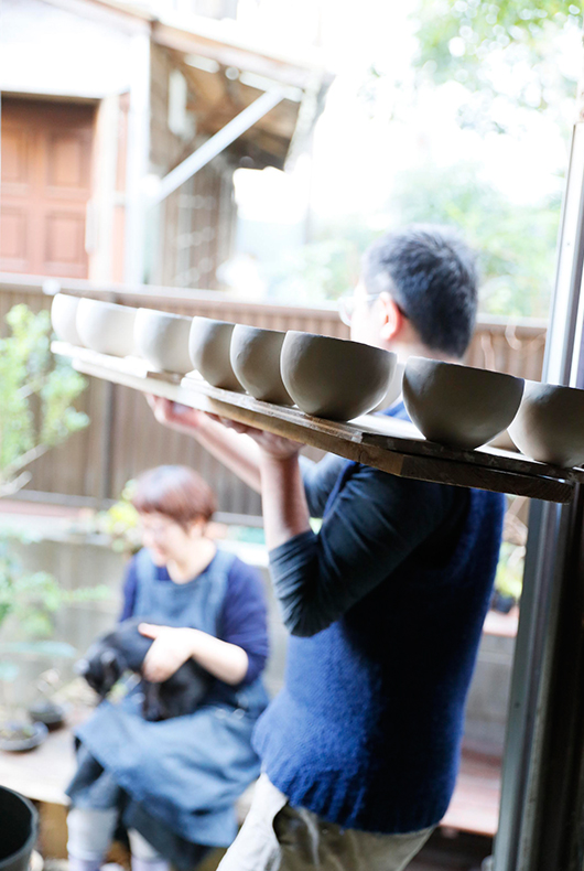 Makoto Asebi and his wife at his home/studio in Japan.